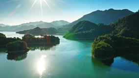 Aerial view of small green islands scattered Qiandao Lake (Thousand Island Lake) with majestic mountains in Hangzhou, China. - Powered by Shutterstock - Get 15% off with code: PIKWIZARD15