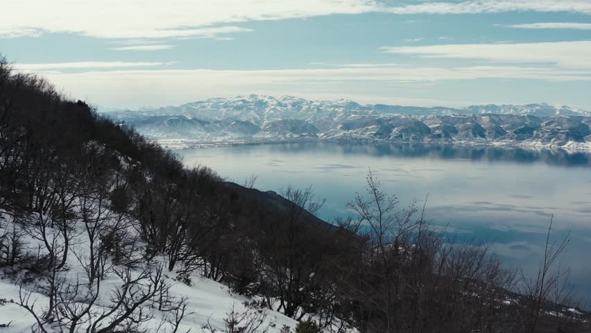 Aerial view of lake ohrid and snowy mountains in winter