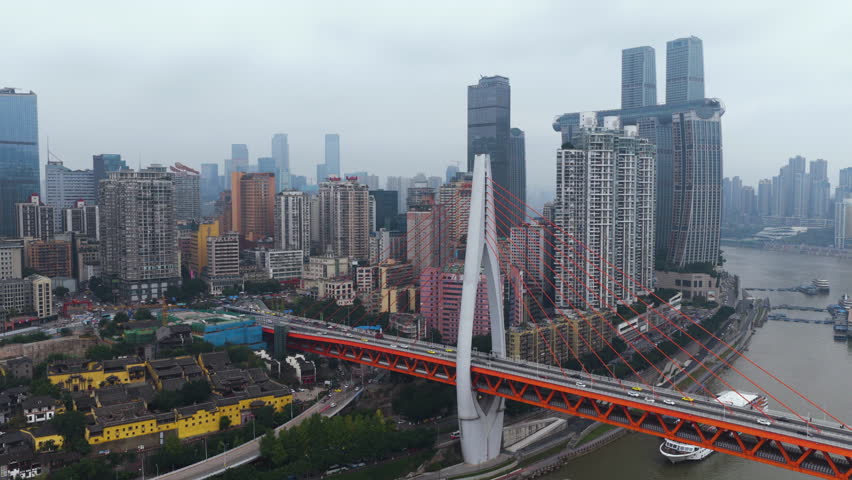 Traffic At Dongshuimen Bridge Over Yangtze River In Chongqing, China. - aerial shot
