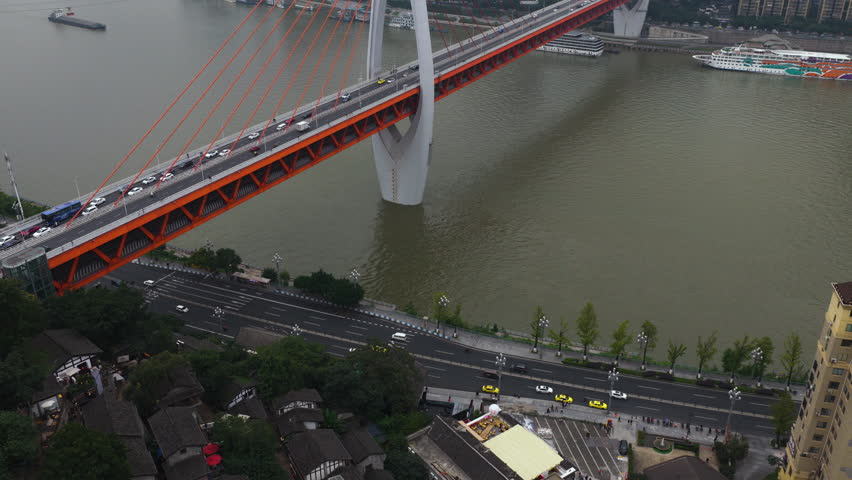 Dongshuimen Bridge Over Yangtze River In The Early Morning In Chongqing, China. - aerial shot