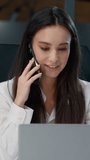 Happy Caucasian businesswoman talking phone call looking in laptop smiling business woman talk mobile conversation communicating smartphone with client friendly smile female agent girl work in office - Powered by Shutterstock - Get 15% off with code: PIKWIZARD15