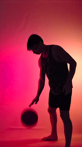 Silhouette of a man with a basketball