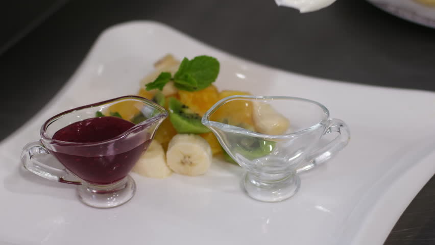 cottage cheese pancakes with jam and sour cream Breakfast in a city cafe in the morning. Cheese pancakes with jam and sour cream.