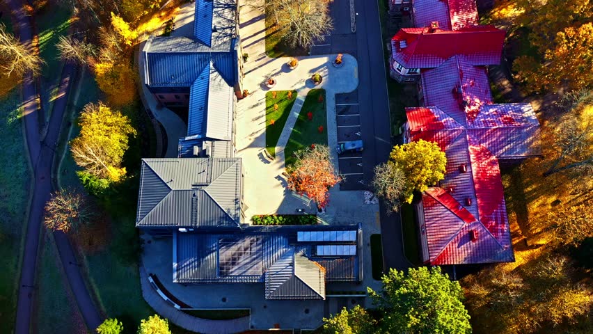 College campus during fall, showcasing academic facilities surrounded by colorful foliage