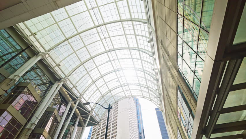 Walking along a downtown Seattle street with views of tall buildings and modern architecture. Urban cityscape perspective in Washington, USA, ideal for travel and lifestyle footage.