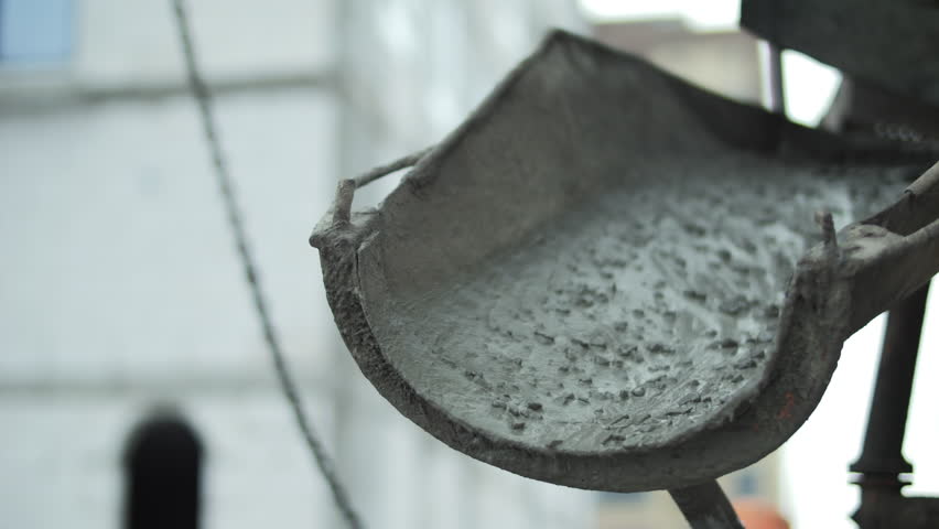 Concrete pouring chute with fresh cement mixture