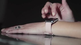 Business woman uses her smartwatch by interacting with its touch screen - Powered by Shutterstock - Get 15% off with code: PIKWIZARD15