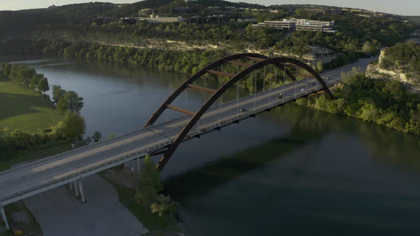 Aerial drone footage of the Pennybacker Bridge (360 Bridge) spanning Lake Austin in Austin, Texas, filmed circa 2020