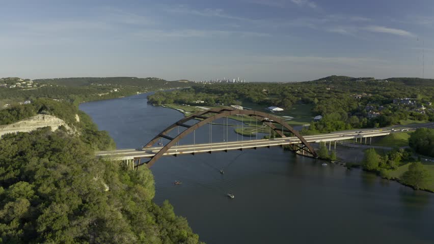 Aerial drone footage of the Pennybacker Bridge (360 Bridge) spanning Lake Austin in Austin, Texas, filmed circa 2020
