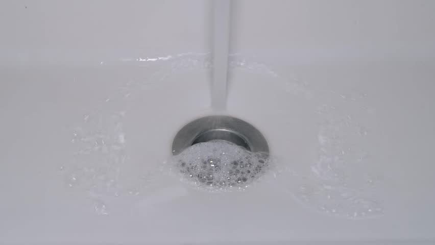 water running down the sink and the sound it makes