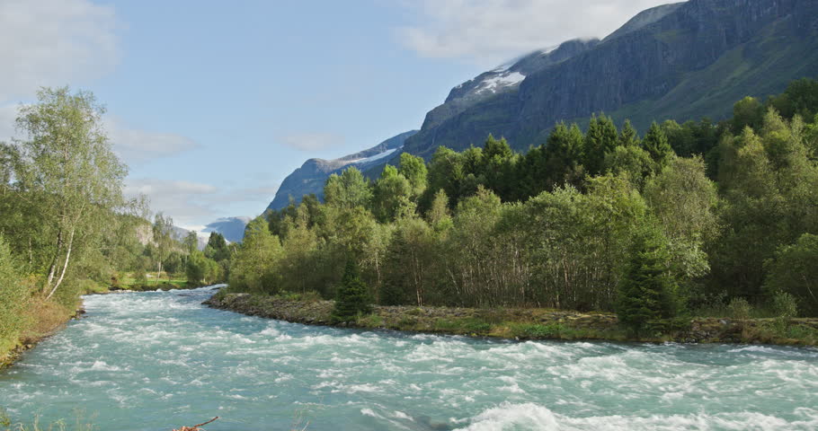Beautiful glacial river flowing through norway valley