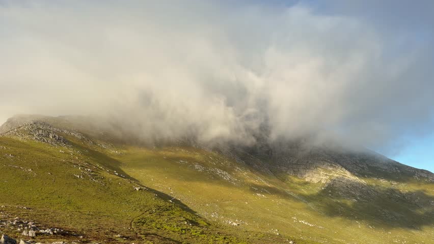 Clouds on a mountain in late summer light near Cape Town, South Africa