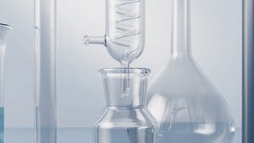 Laboratory setup with beakers distillation apparatus and microscope in motion - Powered by Shutterstock - Get 15% off with code: PIKWIZARD15