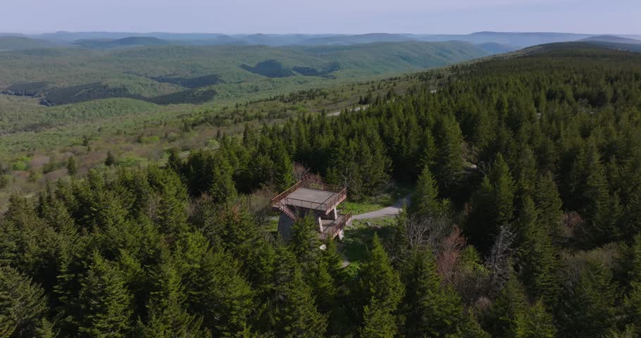 Aerial establishing orbit dense spruce forest at Spruce Knob summit platform in Monongahela National Forest, West Virginia
