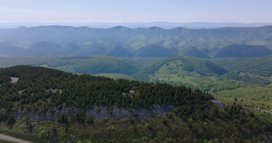 Wide drone panorama establishing layered Appalachian mountains and valleys around Spruce Knob summit