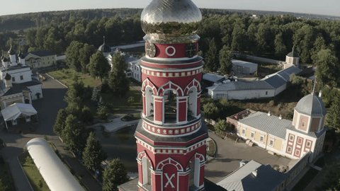 Drone Flying around Clock Tower Into Monastery