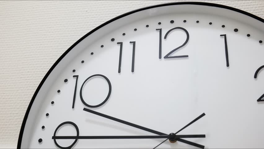 Analog wall clock hands moving in fast motion