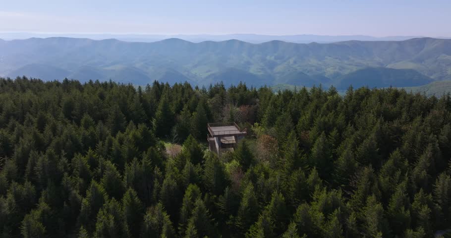 Smooth drone pass across platform to rolling Appalachian ridges and thick forest surrounding Spruce Knob peak, Monongahela National Forest, West Virginia