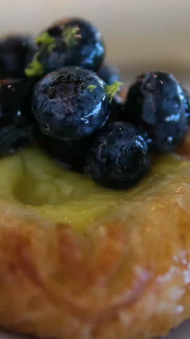 Pastry blueberries icing Dessert table with sweet pastries and mousse cakes. Concept of exquisite confectionery.