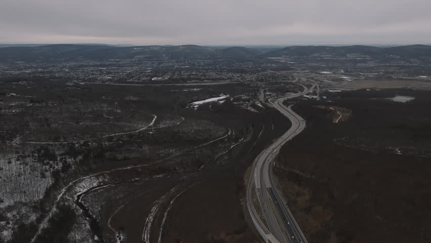 Aerial view of a highway entering Scranton, Pennsylvania. Shot on an overcast day.