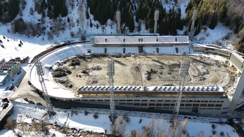 Aerial footage showing the reconstruction of the Medeu, a high-mountain outdoor speed skating and bandy rink located in almaty, kazakhstan 
