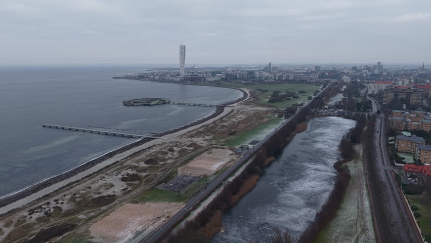 Aerial View of Malmo Sweden on Cold Winter Day, Beach, Frozen Land and Turning Torso Skyscraper