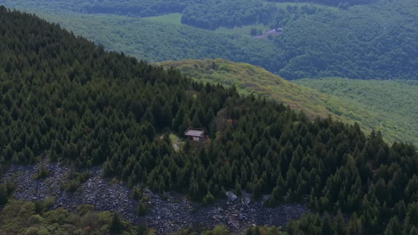 High altitude telephoto aerial across vast spruce forest and mountain layers at West Virginias highest point, Spruce Knob