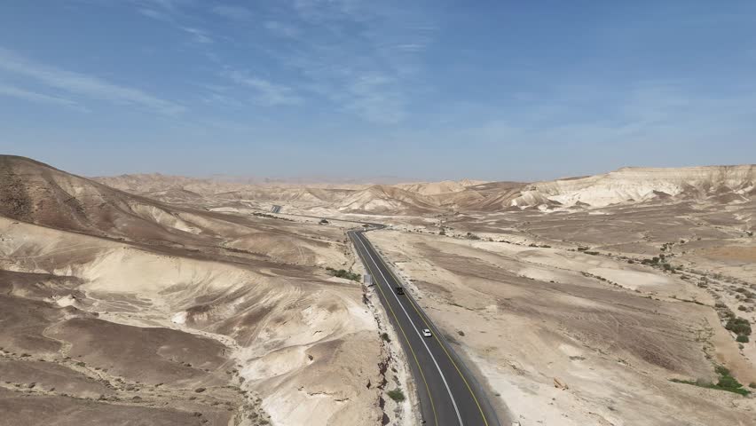 Aerial View of a Lonely Highway Winding Through the Desert Landscape, Israel