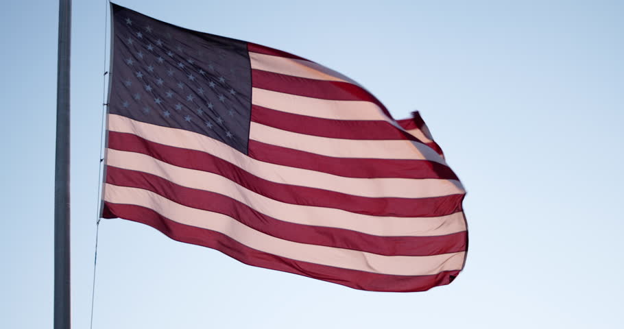 American Flag moving with wind, Warm Sunset Light, War Memorial, World War II, Army and Navy Veterans, Santa Fe New Mexico, Slow Motion