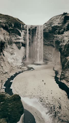 Aerial video slowly moving forward to a big waterfall