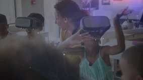 In school, children and teacher using VR headsets for animation exploration. Virtual reality, education, learning, technology, futuristic, classroom - Powered by Shutterstock - Get 15% off with code: PIKWIZARD15