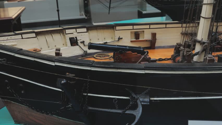 A model of a boat on display in a museum, great for use in historical or educational contexts.