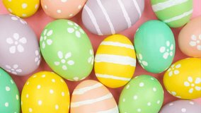 Colorful pastel hand painted Easter eggs. Slow rotating zoom motion. - Powered by Shutterstock - Get 15% off with code: PIKWIZARD15