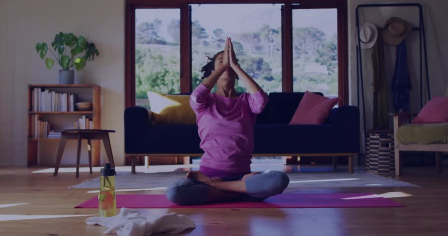 Yoga coach placing palms starting live meditation, showing bell and comment counts circling her. Mindfulness, wellness, tranquility, serenity, interior, lifestyle, spiritual
