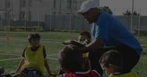 Male coach kneeling, coaching boys on soccer turf, showing hearts network lines for sports tech. Athletics, mentorship, teamwork, outdoor, contemporary, fitness, youth - Powered by Shutterstock - Get 15% off with code: PIKWIZARD15