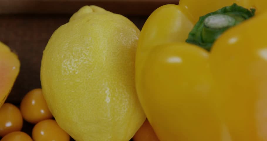 Lemon pepper initiating data overlay, camera shifting left revealing papaya, leafy greens entering. Fresh produce, organic, healthy, digital, high-tech, culinary, vibrant