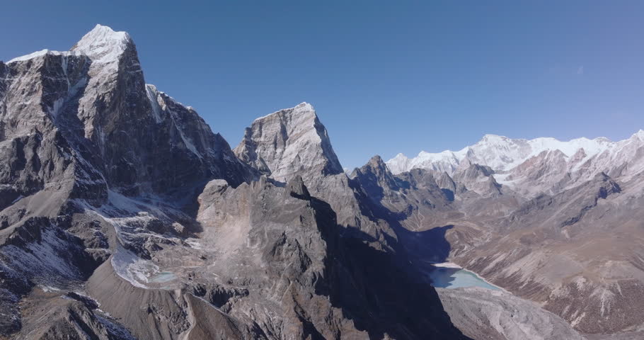 Aerial landscape of Nepal’s Khumbu Himalayas featuring Chola Tsho Lake in the Everest region. High-altitude mountain terrain with dramatic views toward towering 8000-meter Himalayan peaks.