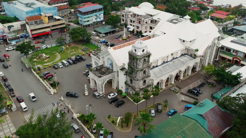 Historic Saint Joseph Cathedral stands prominently in Tagbilaran City Bohol Philippines, aerial establish orbit