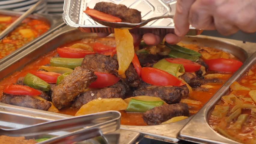 Enjoying delicious dishes at a local food market in summertime