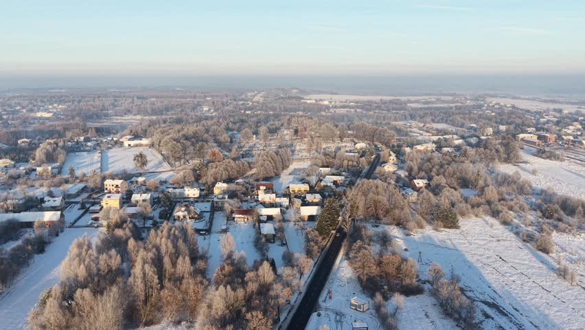 Winter landscape with rural houses and frozen nature