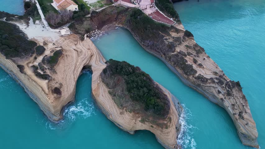 Aerial drone view of Canal d'Amour sandstone cliffs and turquoise sea in Sidari, Corfu Island, Greece, famous summer travel destination and geological landmark