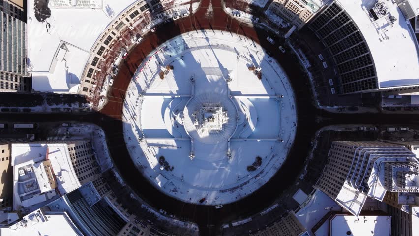 Drone Descends on Soldiers and Sailors Monument Circle in Downtown Indianapolis on Cold Winter Snow Day