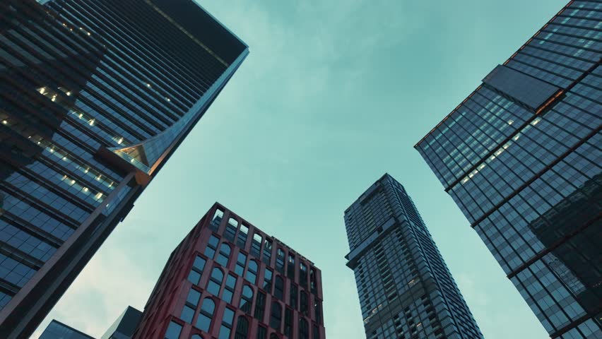 tall skyscrapers buildings looking up perspective, downtown district modern architecture of steel and glass, skyline of big city, low angle look-up view 4k