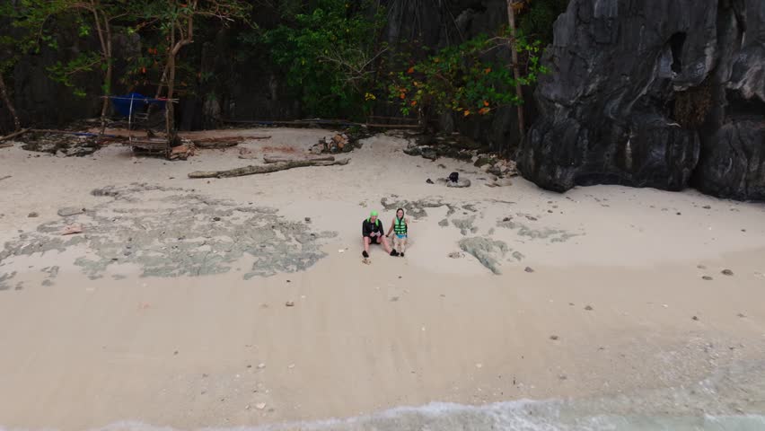 Island hopping moment shows beach solitude, Bacuit Bay Sulu Sea, Philippines