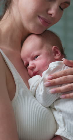 Gentle embrace of mother holding her newborn baby, fostering a deep connection and sense of security