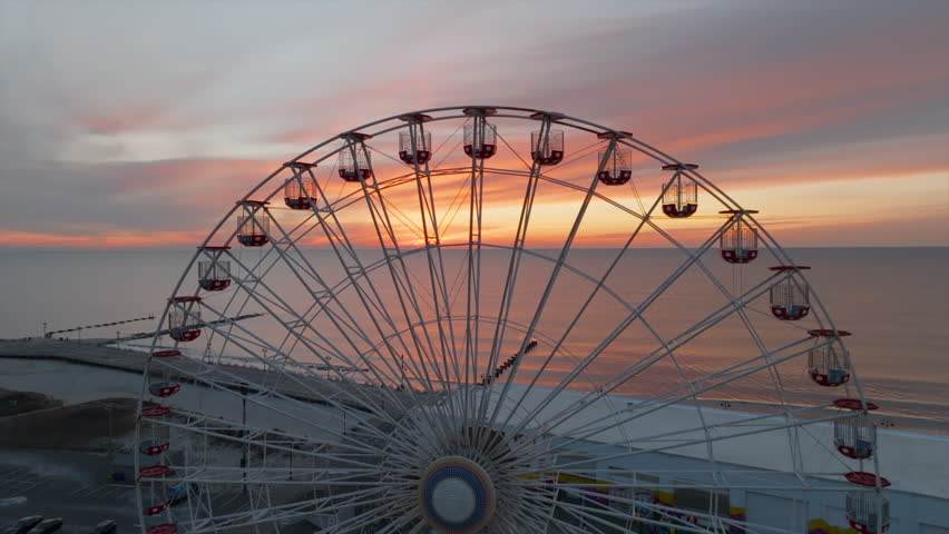 Ferris wheel at sunrise in Ocean City New Jersey boardwalk aerial