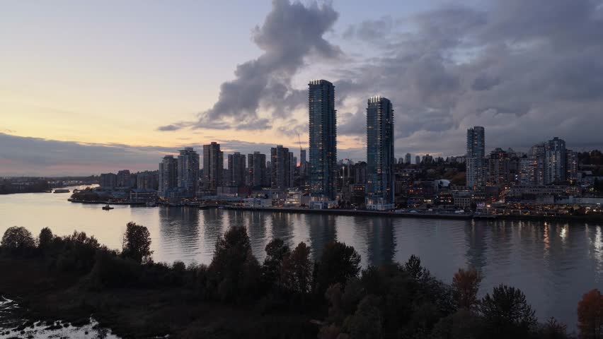 Stunning Sunset View of New Westminster Cityscape with River Reflections in British Columbia, Canada