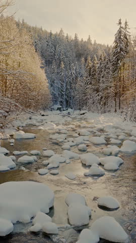Beautiful Winter Mountain River Covered with Ice and Snow