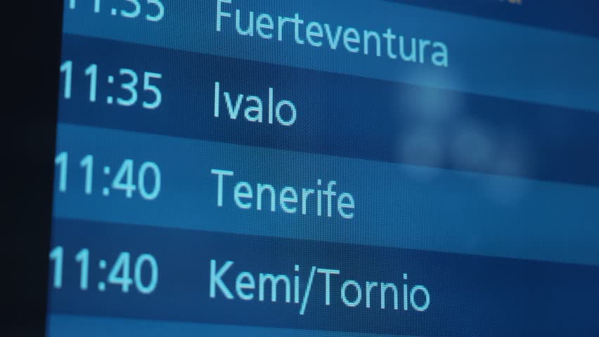 Flight information screen lists departure times for various destinations including Kemi Tornio, Oulu, Kajaani, Copenhagen, and Jyvaskyla in an airport terminal