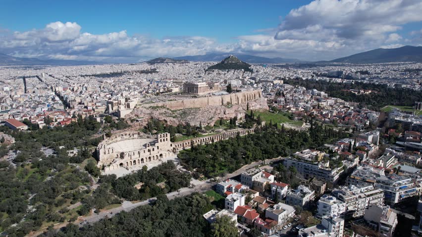 Aerial drone footage of the Parthenon on top of the Acropolis, the ancient citadel of Athens, Greece